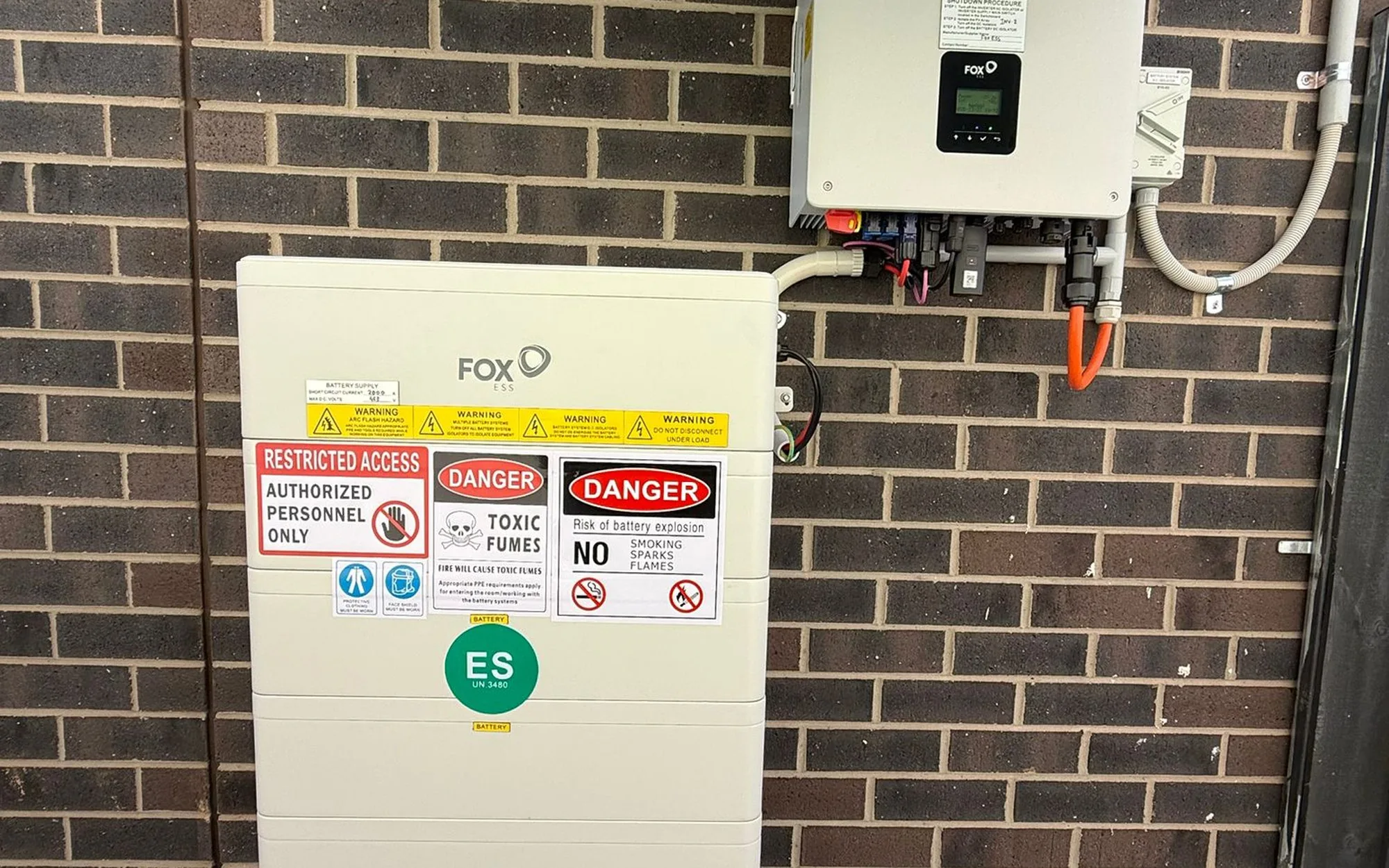 Fox ESS battery and hybrid inverter installed on an external wall
