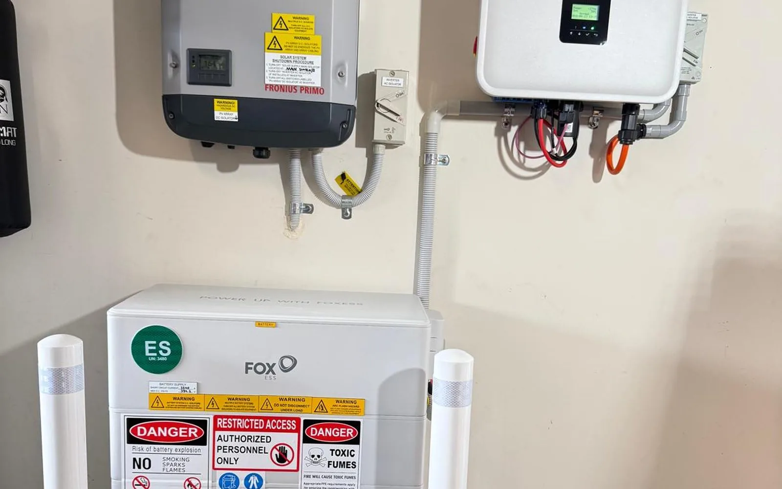 A battery and hybrid inverter added alongside an existing Fronius solar inverter