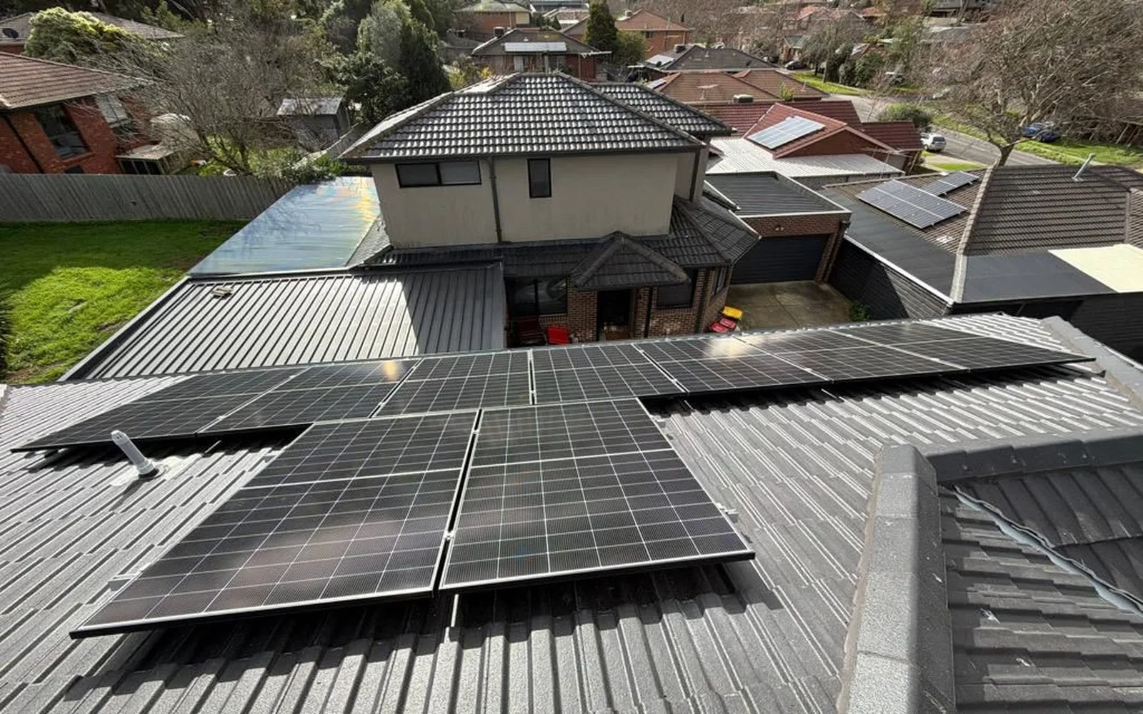 Rooftops across a Melbourne suburb with solar installed
